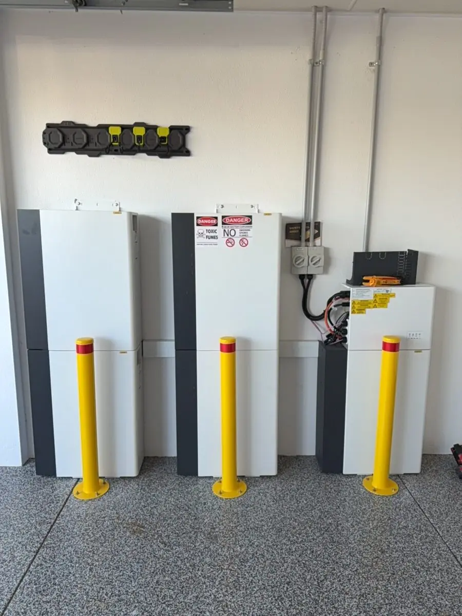 Three AlphaESS battery stacks in a garage